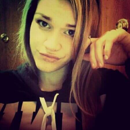 image of a girl taking selfie with a serious expression