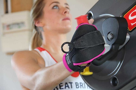girl with hand grips that attach to stationary hand pedal