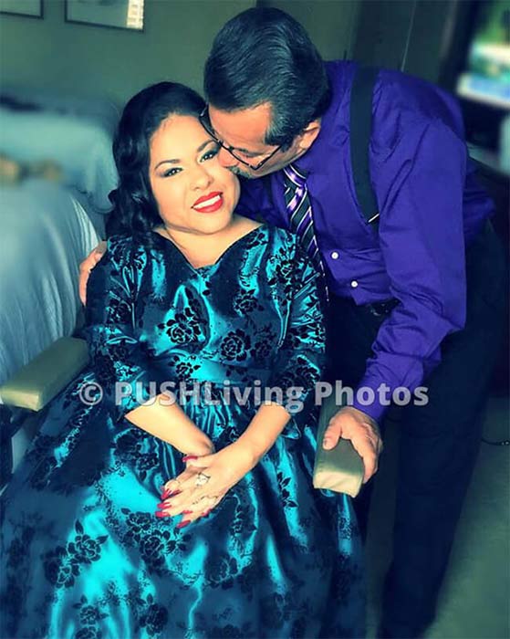 Woman using a power wheelchair at a formal reception with her husband