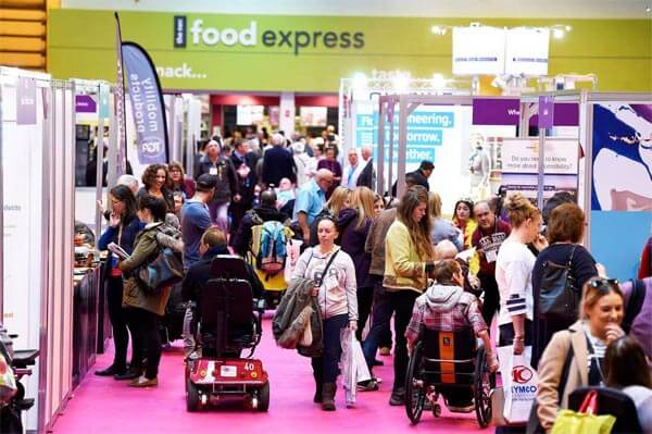 Image of exhibit hall of crowd attending event