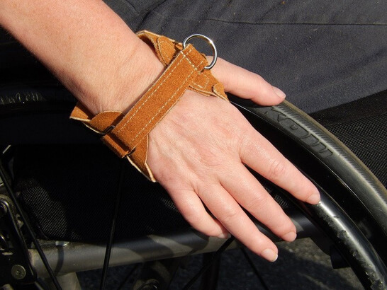 A women wearing a glove to save herself from burns