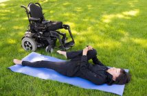 Young disable women exercising in the park