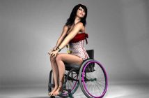 Kim is sitting on a Wheelchair and posing confidently