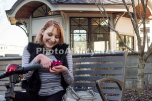 AnnaSDatingProfile 300x200 - Woman sitting on a park bench texting with her mobility scooter