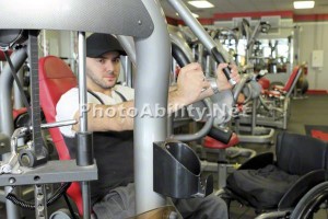 JosephKGym 300x200 - Man in a wheelchair working out at a gym