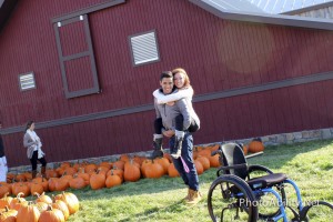 carrypic1 300x200 - Young paraplegic woman selecting pumpkins with her boyfriend for Halloween