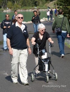 Man walking with wife using walker 230x300 - Man walking with wife using walker