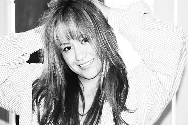 black and white photo of Cynthia Ramirez smiling at camera