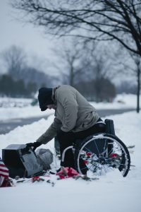 PL V6YPSOZ original 200x300 - Man in a wheelchair attending grave stones on Memorial Day